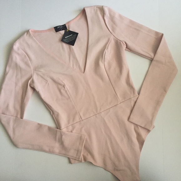 Nasty Gal Tops - Baby pink long sleeve bodysuit by Nasty Gal